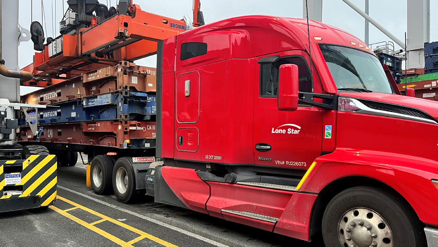 Lone Star Transportation flatbed truck hauling specialized equipment