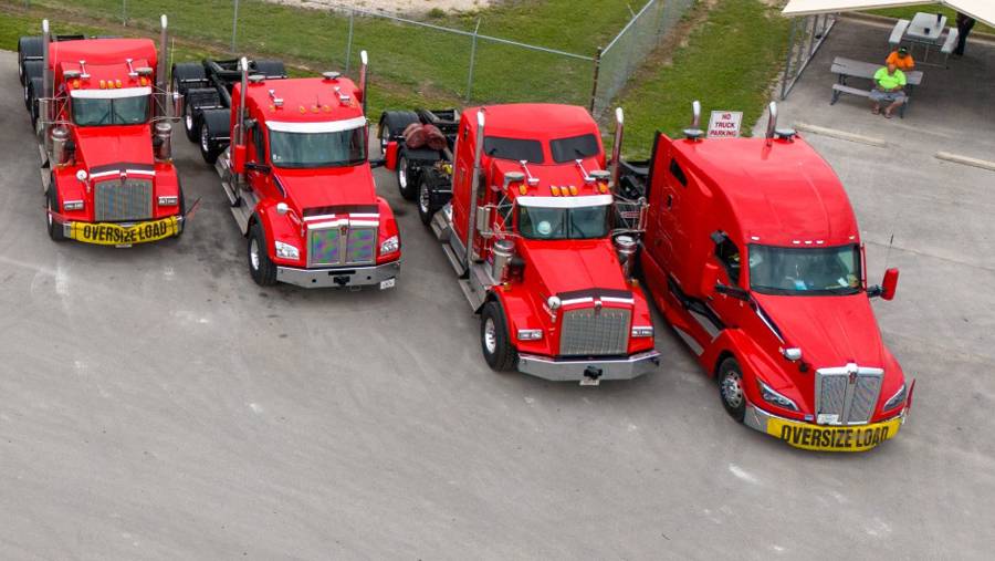 Lone Star Transportation flatbed trucking cabs parked in yard