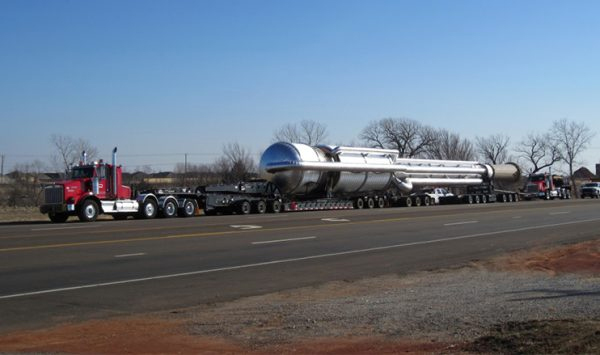 Lone Star truck hauling oversized construction equipment