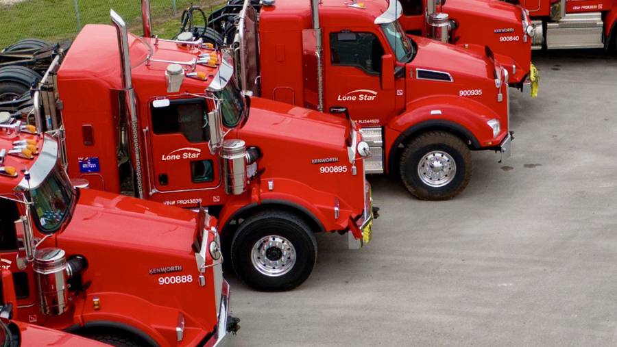 Lone Star heavy haul truck cabs parked in USA terminal