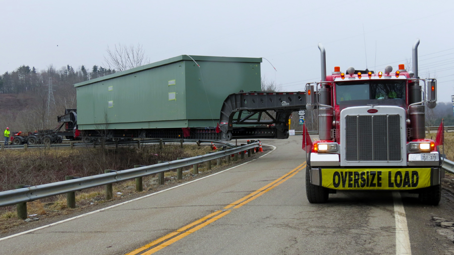 Lone Star Transportation truck hauling project container on North American highway