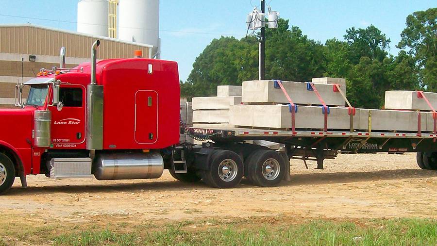 Lone Star Transportation flatbed truck hauling building materials